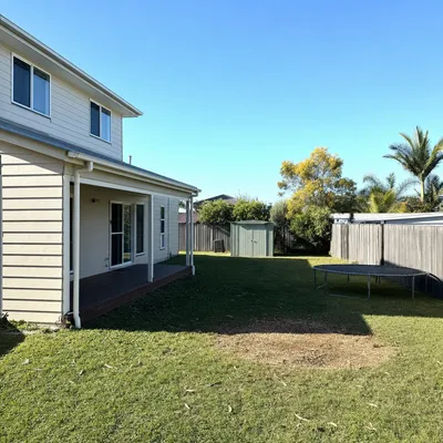 After: Cyclone-split poinciana, sectional dismantle off the house, Townsville